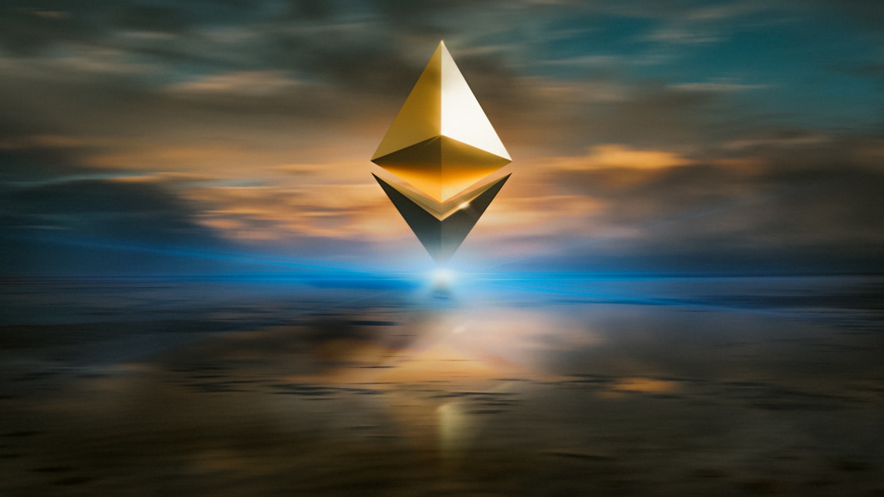 yellow and black triangular structure under cloudy sky during sunset