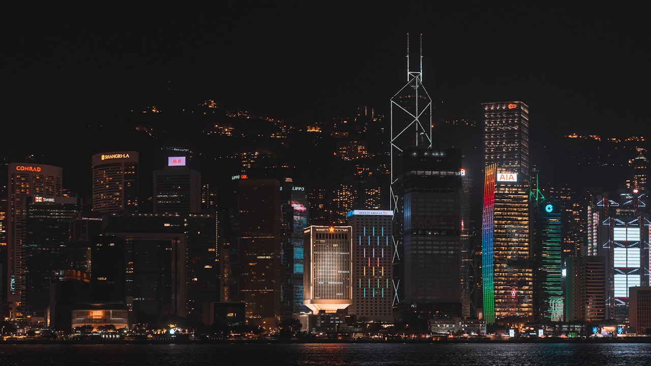 a city at night with a lot of tall buildings