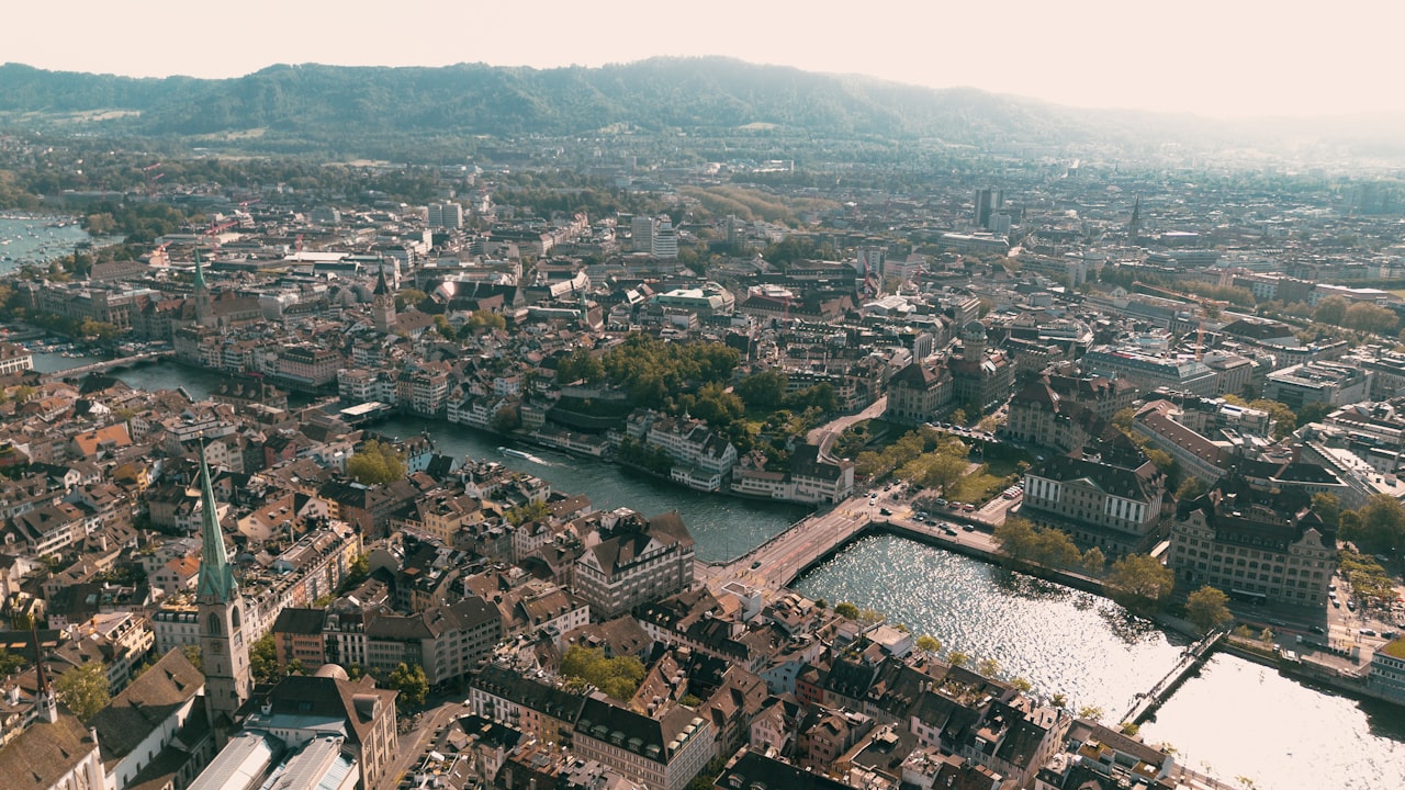 an aerial view of a city with a river running through it