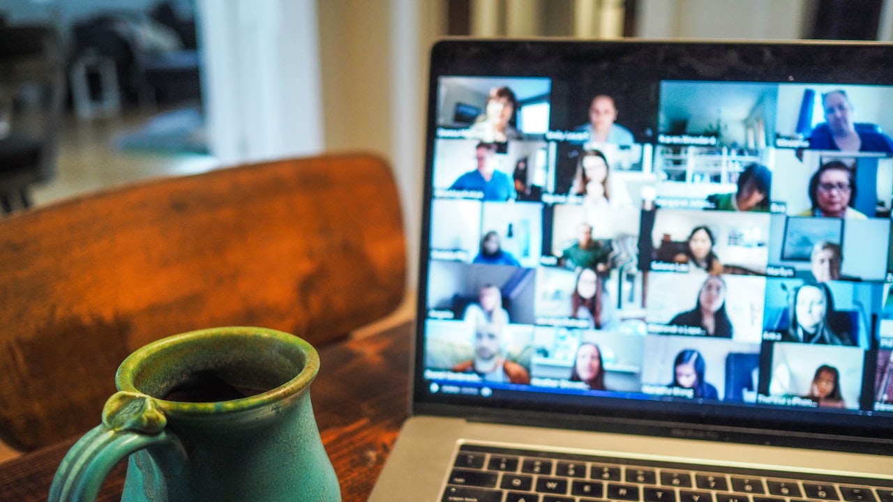 macbook pro displaying group of people