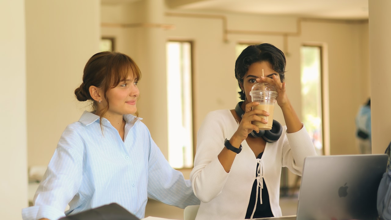 Two women studying together at a table.