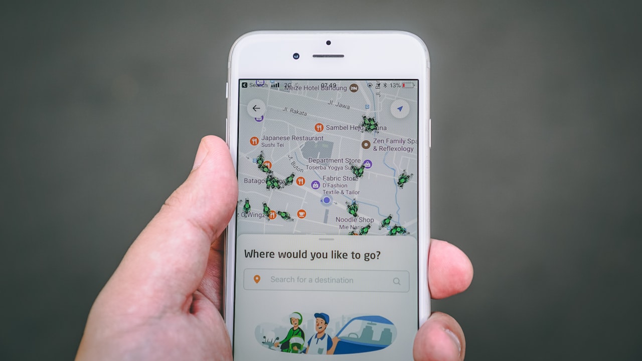 person holding silver iPhone 6