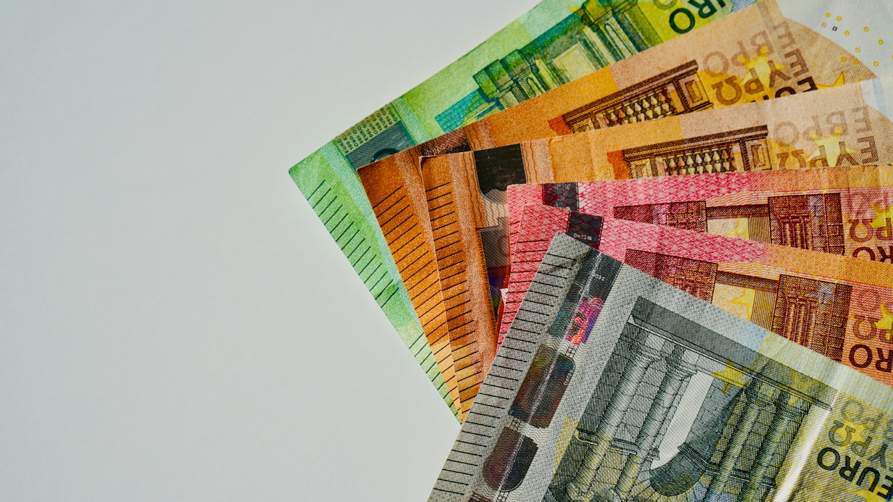 a pile of mexican currency sitting on top of each other