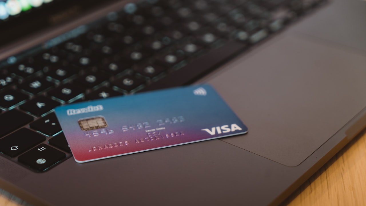 blue and white visa card on silver laptop computer