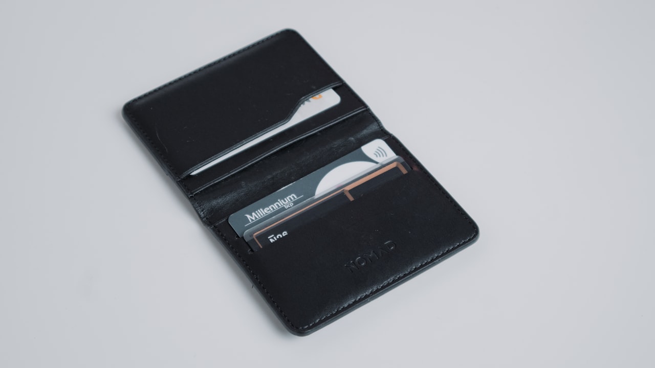 a black leather wallet with a credit card holder