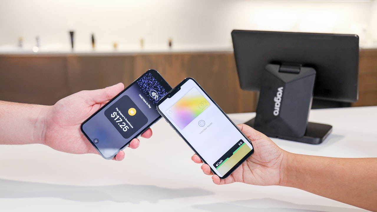Two phones are used for contactless payment.