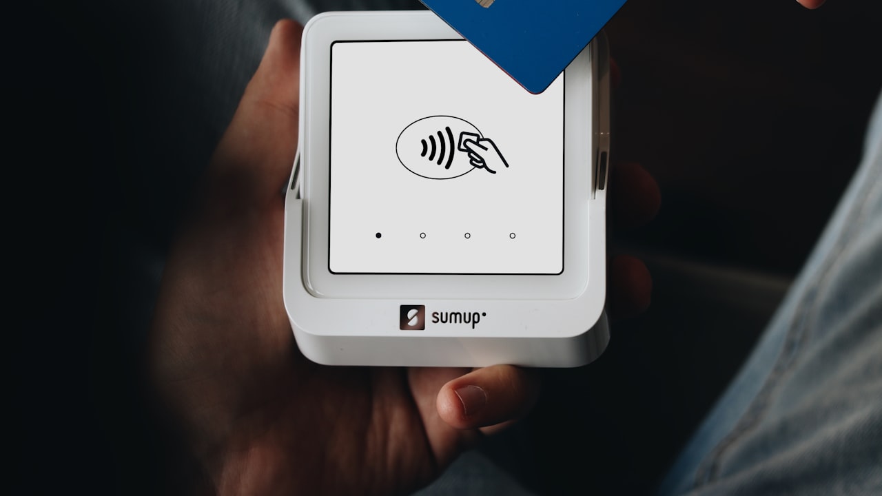 A person holding a credit card in their hand