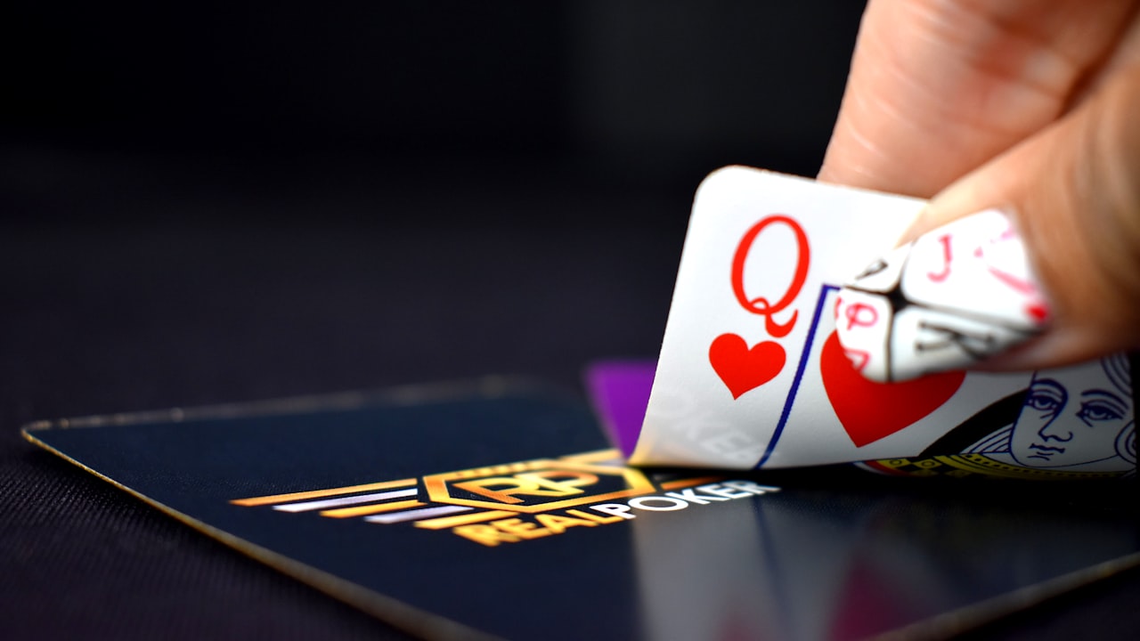 selective focus photography of queen of hearts playing card