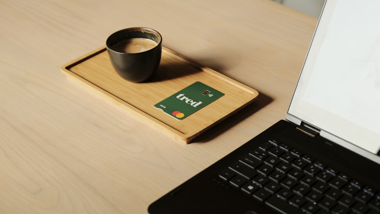 a laptop computer sitting on top of a wooden desk