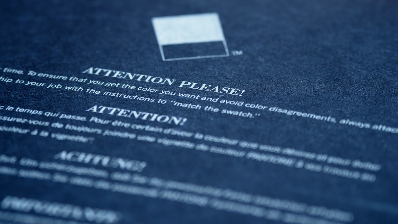 white card on blue textile