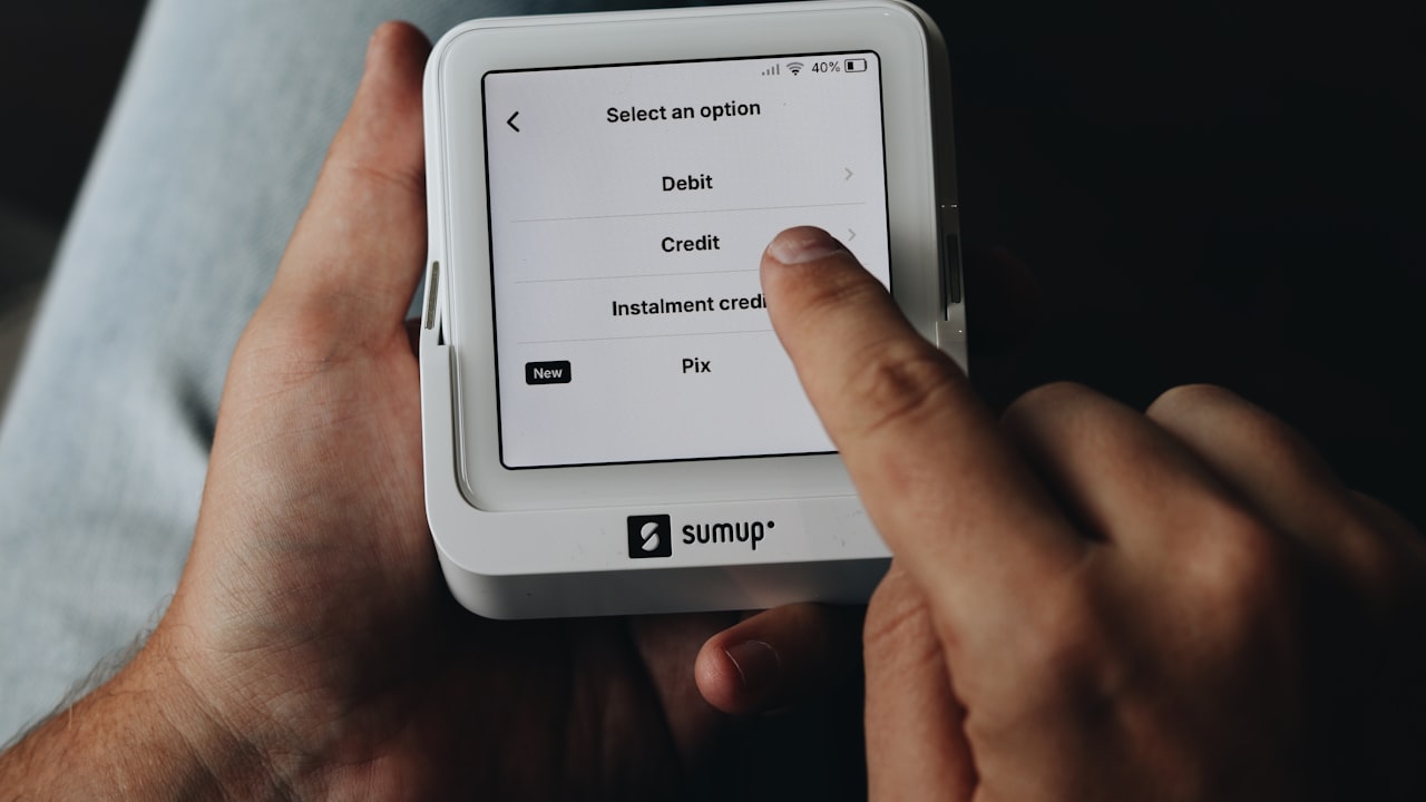 A person is holding a tablet in their hands