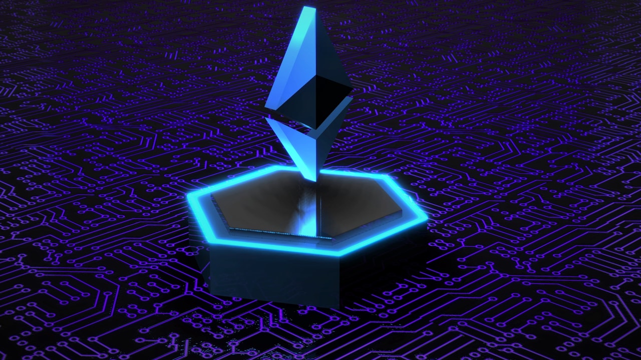 a computer circuit board with a blue light on top of it